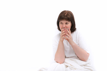 Portrait of young caucasian woman in bed with glass of water. Habit of drinking water in the morning. Copy space. White background