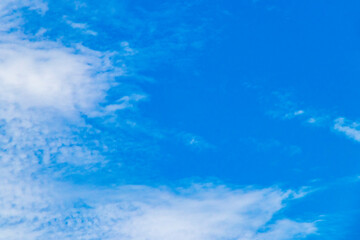 Fototapeta na wymiar Blue sky with chemical clouds chemical sky chemtrails sunny day.