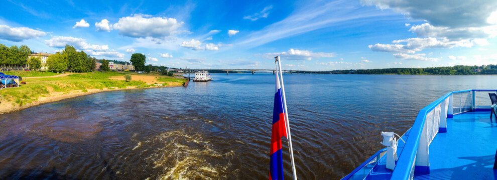 Volga River, Kostroma, Russia. Cruise ship departs from the pier, panoramic view