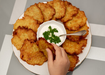 Traditional food on Hanukkah. Fried potatoes.