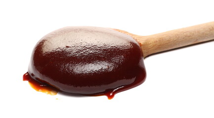 Hip jam, marmalade with wooden spoon isolated on white  