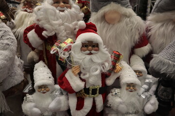 Different Santa Claus toys are sold in the store.