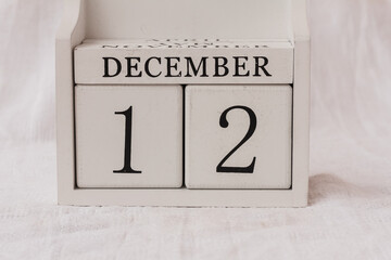 December 10th. Day 12 of month, calendar on white background.  White block calendar present date 12 and month December, winter time, Advent, birthdays, special occasions, website events.. Copy space