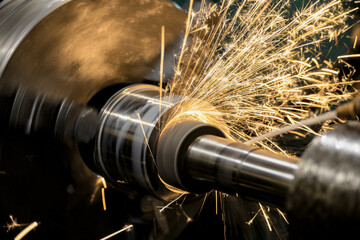 Sparks from the grinding wheel during internal grinding on a cylindrical grinding machine.