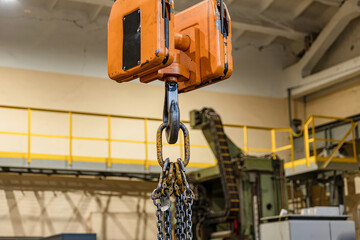 Overhead crane in the workshop for lifting and moving parts.