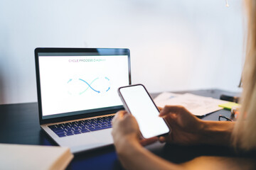 Girl learning with smartphone and laptop at home