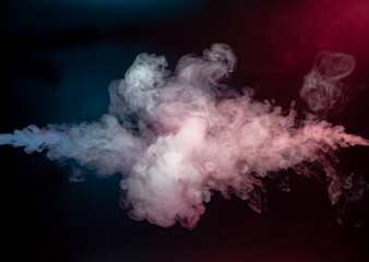 Abstract colorful smoke on black background .