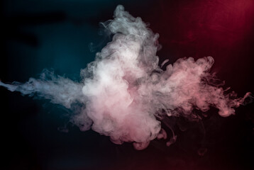 Abstract colorful smoke on black background .