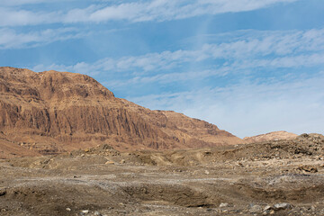 Desert hills and blue sky with clouds