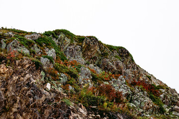 Peaks of Mount Aibga in autumn clouds