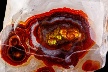 macro mineral stone fire agate on a black background