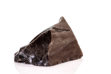 Macro stone obsidian mineral on white background