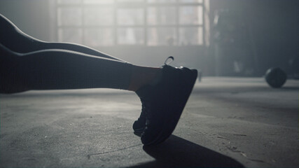 Woman legs doing mountain climber exercise. Sportswoman having workout in plank