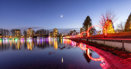 Trail in a park around Lafarge Lake with Christmas Lights. Located in Coquitlam, Greater Vancouver, British Columbia, Canada.