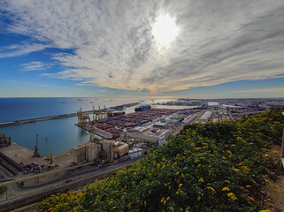 Mediterranean and european city Barcelona and a view over the Harbor with lots of cargo. Industrial

