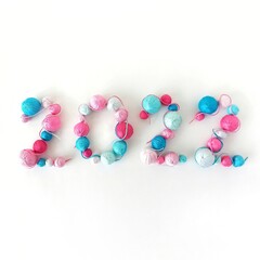 New Year 2022. Blue and pink balls of knitted yarn