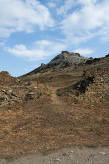 The Genoese fortress is a ancient fortress in the city of Sudak on the Crimean peninsula, built by the Genoese as a stronghold on the Black Sea. Tourism concept, travel, landmarks.