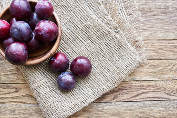 plums fruits natural products on a wooden table top view