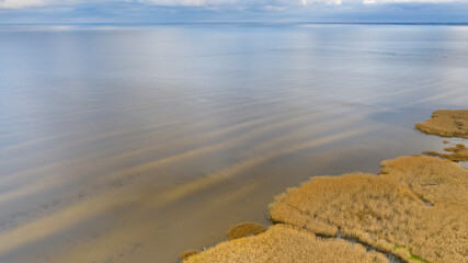 Aerial view to the autumn colored  shallow and sandy  coastal zone of the Lake Peipsi, in Varnja, Estonia. It is the 4th largest lake in Europe