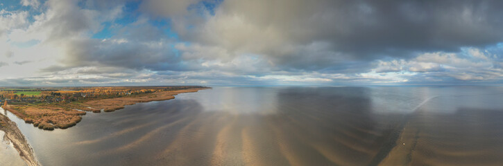 Aerial view to the autumn colored  shallow and sandy  coastal zone of the Lake Peipsi, in Varnja, Estonia. It is the 4th largest lake in Europe