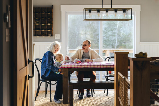 Family having breakfast together in their dining room at home