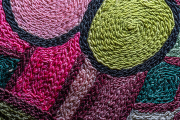 Abstract background closeup of embroidery with art stitches. Rough Coarse thread, thick seams....