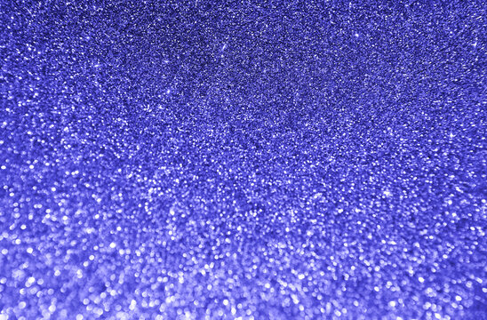 Defocused background in trendy very beri color. Blurred texture of glitter paper. 