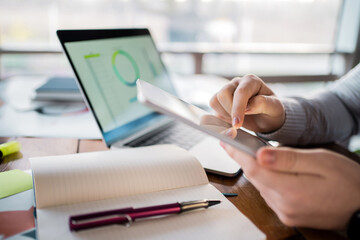 Manager report in the office workplace. Calculates the company's finances for the quarter. Working...