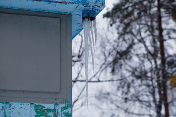 Icicles hanging from the roof.