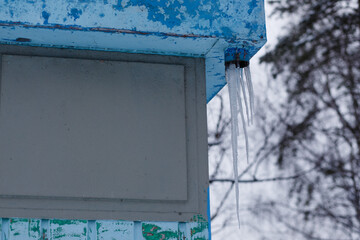 Icicles hanging from the roof.