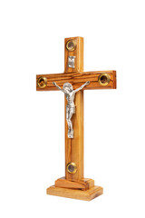 Wooden crucifix standing on white background.