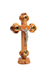 Wooden crucifix standing on white background.