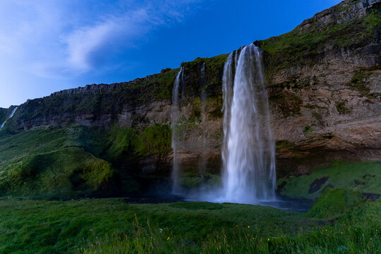 Beautiful view of the Seljalandsfoss waterfall in Iceland on sunset © Gian