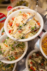 caesar salad on the buffet table in the restaurant