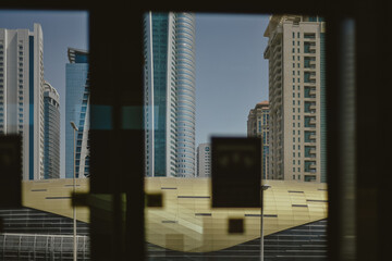 View through the window to the Dubai metro line with skyscrapers background