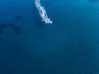 Fototapeta na wymiar Aerial view on jet ski in azure water of a sea