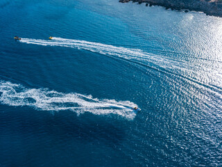 Aerial view on jet ski in azure water of a sea