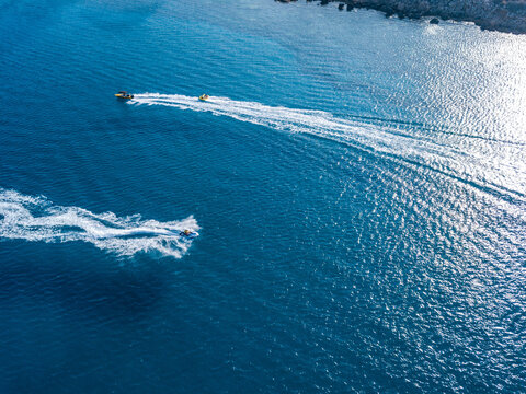 Aerial view on jet ski in azure water of a sea