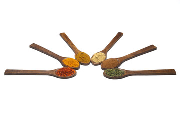 Different kind of spices on a white background.  Oriental spices in spoons, red peppers, curry powder, cinnamon powder, mint powder, colorful peppers. Flat lay, top view.