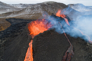 Volcano caldera and flowing lava from aerial view