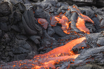 incandescent flowing volcanic lava in volcano