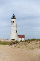 Fototapeta na wymiar Seagull hovering over the Great Point Lighthouse on Nantucket.