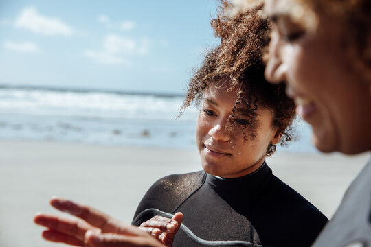 Woman applying sunscreen on the beach