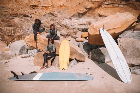 Group of women with surfboards at the beach