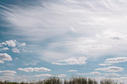 Wispy Clouds in Blue Sky