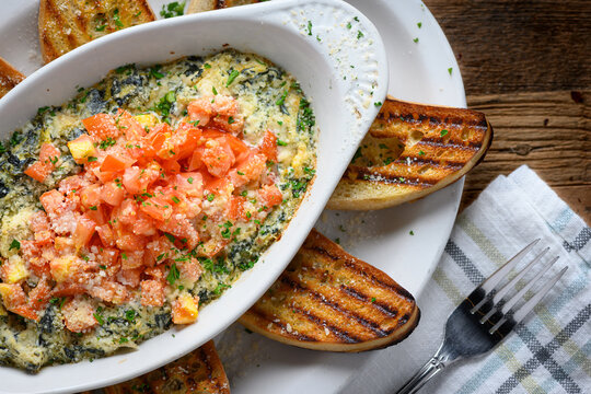 Italian food with bread over a piece of wood
