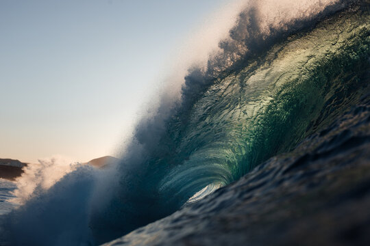 Wave breaking on a sunset beach in Canary Islands