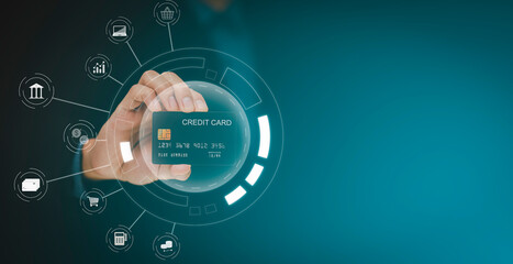 Businessman holding credit card for makes a purchase on the Internet on the laptop computer with credit card, online payment, shopping online, e-commerce, internet banking, spending money concept.