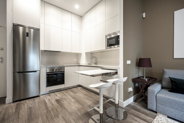 living room and kitchen in the back in a vacation rental loft furnishing