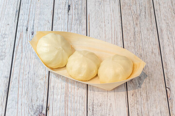 Baozi, or simply bao, bau or min pao, is a type of stuffed bun or bread usually steamed, common in...